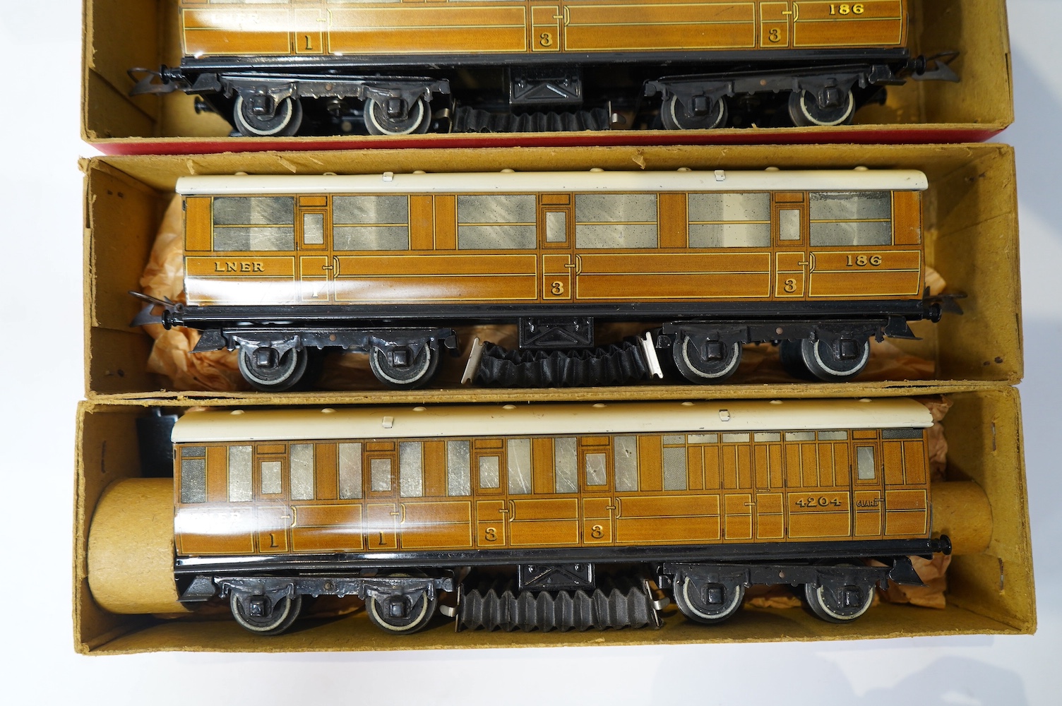 Twenty-four HO gauge model railway by Lima, Trix, Fleischmann, etc. including a German DB 4-6-2 tender locomotive, 10 001, fourteen Continental outline bogie coaches, 4-wheel coaches, and freight wagons. Condition - fair